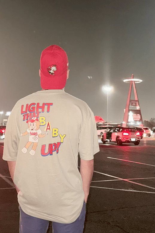 Man wearing the LTBU ivory oversized tee large